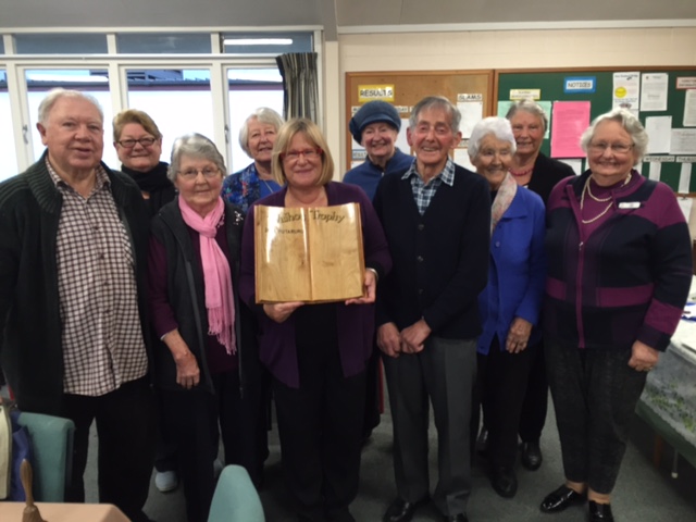 Waihou Trophy victors: Stella proudly displays the Waihou Shield in front of some of the Matamata contingent.